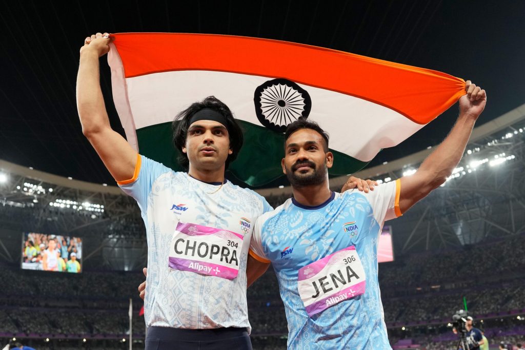 Silver medalist India's Kishore Kumar Jena, right, and gold medalist India's Neeraj Chopra, celebrate after the men's javelin throw final at the 19th Asian Games