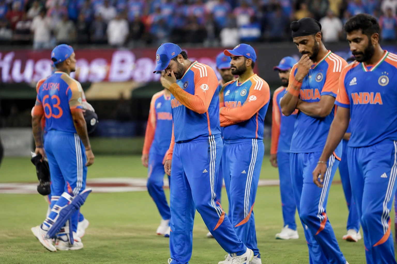 Indian cricket team players reflecting after a difficult match