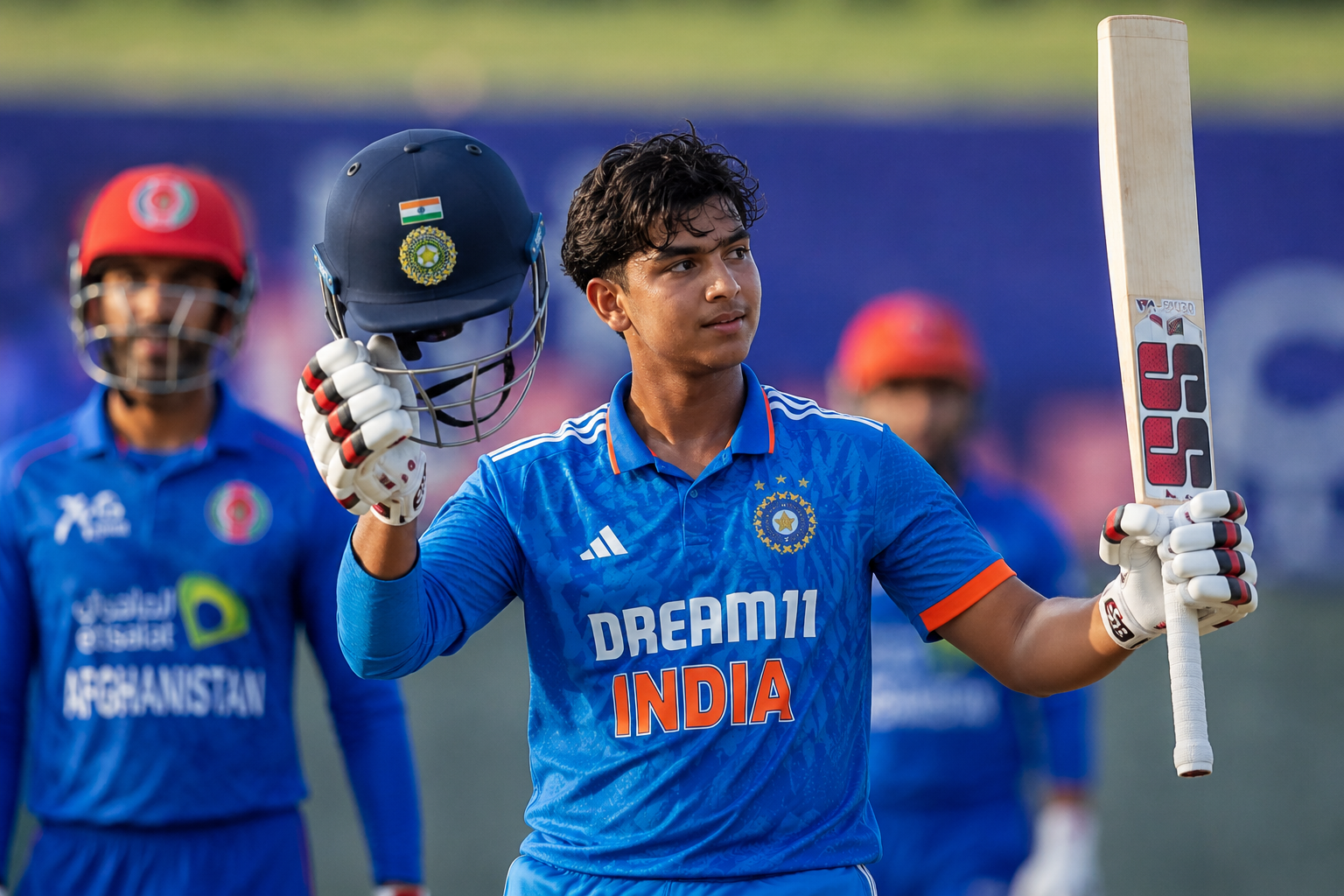 Vaibhav Sooryavanshi holding his bat and helmet during an India cricket match