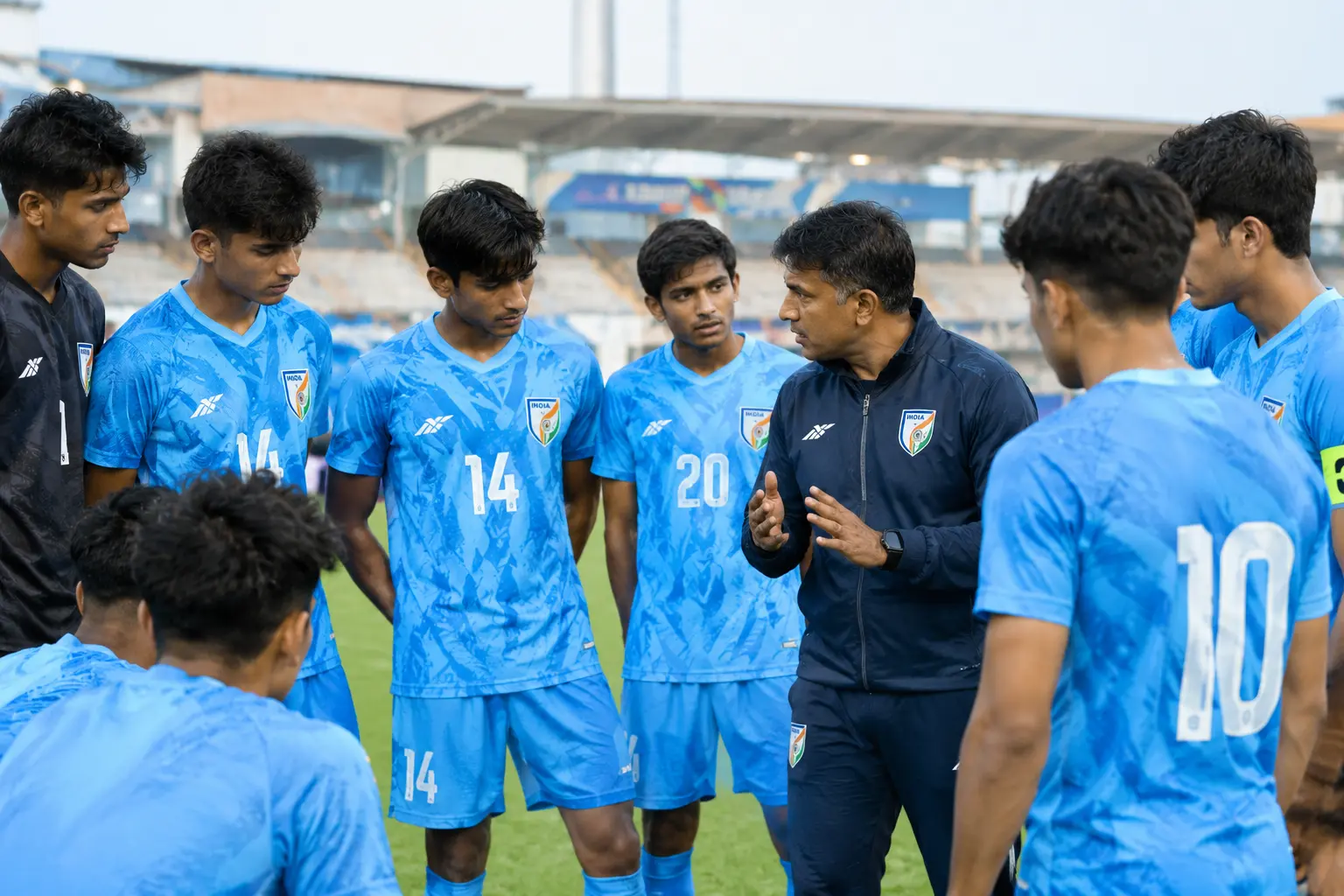 India U19 football team players listening to their coach during a training session